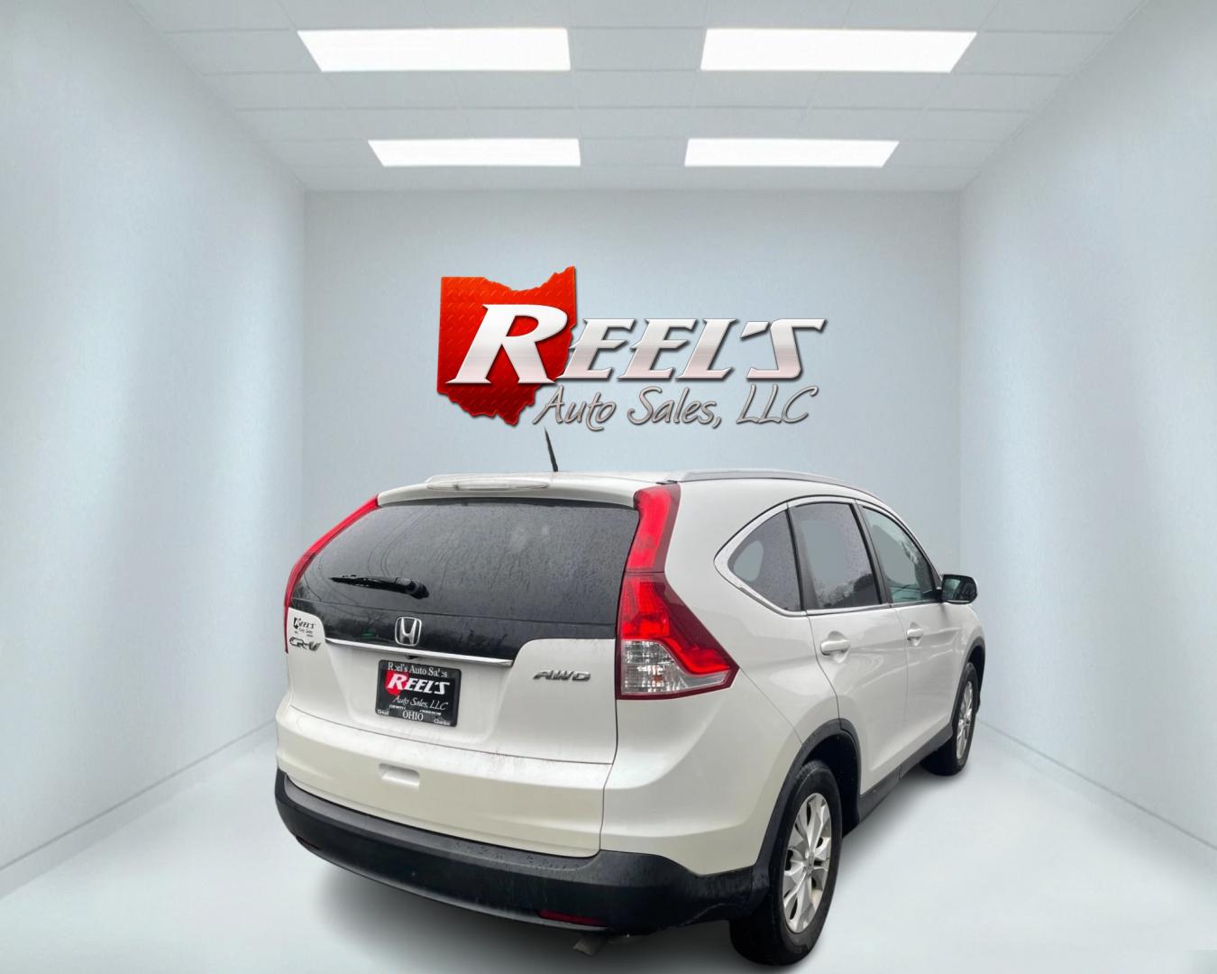 2013 White /Black Honda CR-V EX-L 4WD 5-Speed AT (5J6RM4H71DL) with an 2.4L I4 DOHC 16V engine, 5-Speed Automatic transmission, located at 11115 Chardon Rd. , Chardon, OH, 44024, (440) 214-9705, 41.580246, -81.241943 - This 2013 Honda CR-V EX-L AWD boasts a reliable 2.4L engine paired with a 5-speed automatic transmission, catering to drivers seeking both efficiency and all-wheel-drive capability. Its single-owner status may reassure potential buyers about its maintenance history. Luxurious features such as a leat - Photo#7